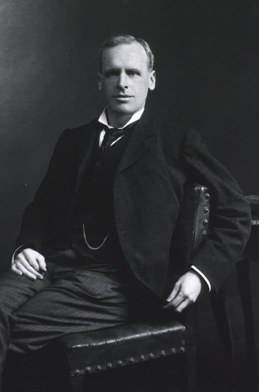 A seated studio portrait of Ernest Starling in a dark three-piece suit